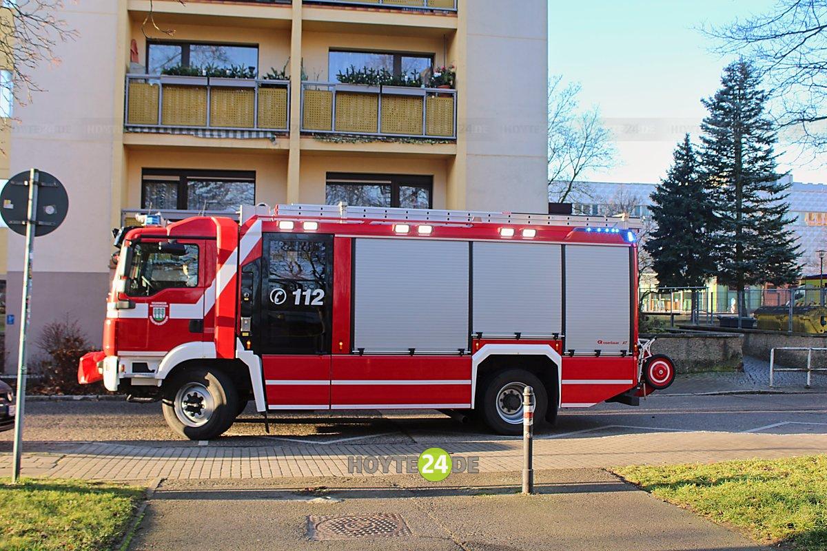 Man sieht ein Feuerwehr-Auto im WK III.